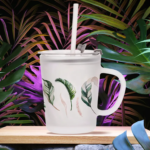 Frosted glass mug with plastic lid and straw